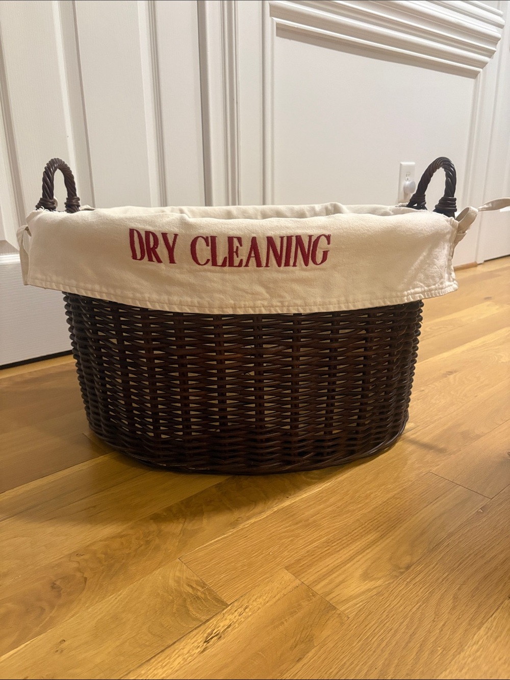 Vintage Pottery Barn brown wicker featuring a removable canvas liner and handles